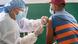 A health worker inoculates the doze of Janssen vaccine to a man at the municipality hospital in Mulpani A health worker inoculates the doze of Janssen vaccine to a man at the municipality hospital in Mulpani