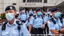 30.07.21 *** Police gather outside the High Court in Hong Kong on July 30, 2021, as Tong Ying-kit faces sentencing after he was convicted of terrorism and inciting secession in the first trial conducted under a national security law imposed by China. (Photo by ISAAC LAWRENCE / AFP) (Photo by ISAAC LAWRENCE/AFP via Getty Images)