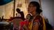 A woman holding her malnourished baby awaiting treatment in a medical tent A woman holding her malnourished baby awaiting treatment in a medical tent