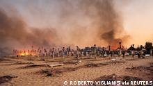 A view of a fire at Le Capannine beach in Catania, Sicily, Italy, July 30, 2021, in this photo obtained from social media on July 31, 2021. Roberto Viglianisi/via REUTERS THIS IMAGE HAS BEEN SUPPLIED BY A THIRD PARTY. MANDATORY CREDIT. NO RESALES. NO ARCHIVES.