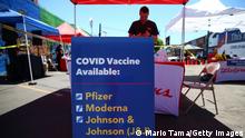 LOS ANGELES, CALIFORNIA - JUNE 25: A sign displays the types of COVID-19 vaccination doses available at a Walgreens mobile bus clinic on June 25, 2021 in Los Angeles, California. The United States will miss President Joe Biden's goal of delivering at least one coronavirus vaccine dose to 70 percent of adults by the July 4th holiday. (Photo by Mario Tama/Getty Images)
