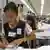 ARCHIV - Bopha Poav näht an ihrem Arbeitsplatz in der "New Island Clothing"-Fabrik am Flughafen von Phnom Penh in Kambodscha (Archivfoto vom 14.06.2007). 55 Dollar verdient sie im Monat. Dafür muss sie 48 Stunden pro Woche arbeiten. Die Kambodschanerinnen nähen für alles, was Rang und Namen hat: C&A, H&M, Quelle, Metro, Adidas. Deutschland ist nach den USA zweitgrößter Kunde der boomenden kambodschanischen Textilindustrie. Im vergangenen Jahr wurden Textilien im Wert von 300 Millionen Euro aus Kambodscha nach Deutschland eingeführt, fast 14 Prozent mehr als im Jahr zuvor. Garantien, dass die T-Shirts und Hemden in deutschen Läden nicht in obskuren Fabriken doch von Kinderhand oder für weniger als einen Hungerlohn genäht wurden, gibt es nicht. Foto: Christiane Oelrich dpa (zu dpa-Reportage: "Im Kambodscha nährt Nähen für reichen Westen goldene Träume" vom 25.07.2007) +++(c) dpa - Report+++