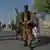 Milisi dan personili militer Afghanistan di Herat, 30 Juli 2021.
