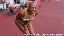 Malaika Mihambo, of Germany, celebrates after winning the gold medal in the women's long jump final at the 2020 Summer Olympics, Tuesday, Aug. 3, 2021, in Tokyo. (AP Photo/Matthias Schrader)