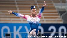 Simone Biles, of the United States, warms up prior to the artistic gymnastics balance beam final at the 2020 Summer Olympics, Tuesday, Aug. 3, 2021, in Tokyo, Japan. (AP Photo/Natacha Pisarenko)