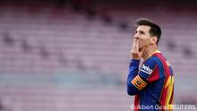 FILE PHOTO: Soccer Football - La Liga Santander - FC Barcelona v Celta Vigo - Camp Nou, Barcelona, Spain - May 16, 2021 Barcelona's Lionel Messi reacts after Clement Lenglet is sent off REUTERS/Albert Gea/File Photo