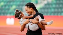 EUGENE, OREGON - JUNE 26: Allyson Felix celebrates with her daughter Camryn after day nine of the 2020 U.S. Olympic Track & Field Team Trials at Hayward Field on June 26, 2021 in Eugene, Oregon. (Photo by Steph Chambers/Getty Images)