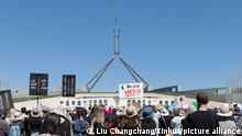 (210315) -- CANBERRA, March 15, 2021 (Xinhua) -- Photo taken on March 15, 2021 shows marches and protests in front of the Parliament House in Canberra, Australia. Thousands of Australians have gathered across the country on Monday to protest misogyny in the federal parliament. Protestors participated in more than 40 rallies, calling for an end to sexism, misogyny, dangerous workplace cultures and lack of equality in politics and the community at large as part of the March4Justice. The movement, which organizers described as the biggest uprising of women that Australia's seen, was established after former government adviser Brittany Higgins went public with allegations that she was raped in the Parliament House in 2019, and Attorney-General Christian Porter was accused of a historical rape. (Photo by Liu Changchang/Xinhua)