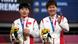 Shanju Bao and Tianshi Zhong celebrate their gold medals during a medal ceremony for the track cycling women's team sprint finals in Tokyo Shanju Bao and Tianshi Zhong celebrate their gold medals during a medal ceremony for the track cycling women's team sprint finals in Tokyo