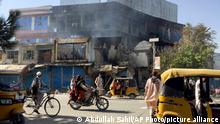 Shops are damaged shops after fighting between Taliban and Afghan security forces in Kunduz city, northern Afghanistan, Sunday, Aug. 8, 2021. Taliban fighters Sunday took control of much of the capital of Kunduz province, including the governor's office and police headquarters, a provincial council member said. (AP Photo/Abdullah Sahil)