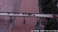 An aerial view shows a herd of wild Asian elephants crossing the Yuanjiang River in Yuanjiang county of Yuxi, Yunnan province, China August 8, 2021. The herd of 14 wild Asian elephants is on its way back to its traditional habitat, according to provincial officials. Picture taken with a drone August 8, 2021. China Daily via REUTERS ATTENTION EDITORS - THIS IMAGE WAS PROVIDED BY A THIRD PARTY. CHINA OUT. TPX IMAGES OF THE DAY