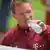 Bayern Munich coach Julian Nagelsmann sips a bottle of water