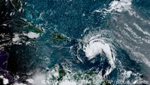 This satellite image provided by the National Oceanic and Atmospheric Administration (NOAA) shows a tropical storm east of Puerto Rico in the Caribbean, at 7:50am EST, Tuesday, Aug. 10, 2021. The National Hurricane Center issued tropical storm warnings for the U.S. Virgin Islands and Puerto Rico, where forecasters expected the potential cyclone to strengthen Tuesday into the sixth named storm, Fred, of the Atlantic hurricane season. (NOAA/NESDIS/STAR GOES via AP)
