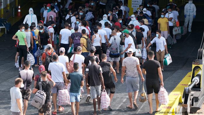 Migrants board the 'MS GNV Azzurra' quarantine ship, which has has been sent to the Italian island of Lampedusa on August 4, 2020