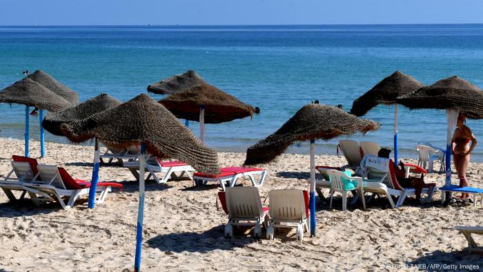 Tourists relax at a hotel beach in Tunisia's coastal city of Sousse