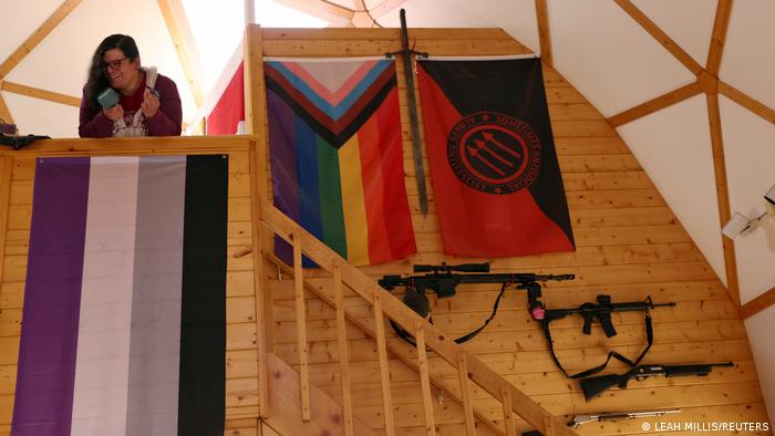 Bonnie Nelson stands above the asexual flag as it hangs with several other flags representing gender and sexual identity at the Tenacious Unicorn Ranch in Westcliffe, Colorado, US