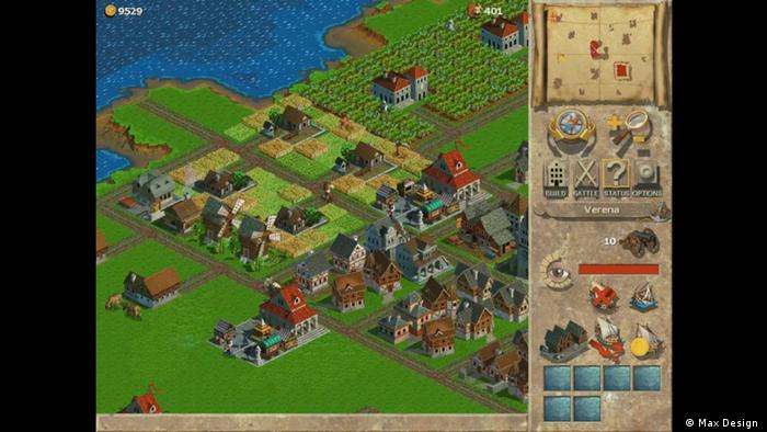 Screenshot from Anno (1998) shows a town by a lake with house, roads and fields 