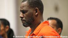 FILE - In this Sept. 17, 2019 file photo, R. Kelly appears during a hearing at the Leighton Criminal Courthouse in Chicago. The singer pleaded not guilty on Wednesday, Dec. 18, 2019, in federal court in the Brooklyn borough to New York, to charges he schemed to pay for a fake ID for an unnamed female the day before he married teen R&B singer Aaliyah in 1994. (Antonio Perez/Chicago Tribune via AP, Pool, File)