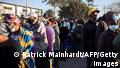People queue outside a polling station in Lusaka on August 12, 2021 as Zambians elect their next president after a tense campaign dominated by economic woes in Africa's first coronavirus-era sovereign defaulting country. (Photo by Patrick Meinhardt / AFP) (Photo by PATRICK MEINHARDT/AFP via Getty Images)