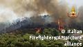 In this photo released by the Italian Firefighters, a view of a fire near Giarratana, in the province of Ragusa, Sicily, Italy, Thursday, Aug. 12, 2021, as many wildfires continue plaguing the region. Sicily, Sardinia, Calabria and also central Italy, as temperatures reached a record hight in Floridia, Sicily, were badly hit by wildfires. Climate scientists say there is little doubt that climate change from the burning of coal, oil and natural gas is driving extreme events, such as heat waves, droughts, wildfires, floods and storms. (Italian Firefighters via AP)