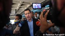 12.7.2021***Opposition leader Juan Guaido speaks to reporters at the car park of his residence in Caracas, on July 12, 2021. - The Venezuelan opposition on Monday denounced the arrest of a leader very close to Juan Guaid0, who for his part said he had been momentarily kidnapped by security officials at his residence in Caracas. (Photo by Federico Parra / AFP)