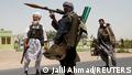 FILE PHOTO: Former Mujahideen hold weapons to support Afghan forces in their fight against Taliban, on the outskirts of Herat province, Afghanistan July 10, 2021. REUTERS/Jalil Ahmad/File Photo