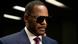 R Kelly, man in a suit and wearing sunglasses R Kelly, man in a suit and wearing sunglasses