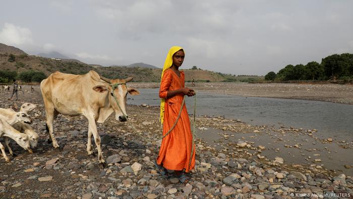 Girl by the river in Yemen