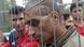 A man waits at a fence in the Rudninkai refugee camp. A man waits at a fence in the Rudninkai refugee camp.