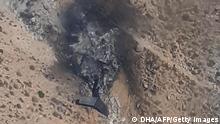 This videograb image taken and released by DHA Turkish News Agency on August 14, 2021 shows a general view of the wreckage of a Russias Bombadier Be-200 aircraft at Kahramanmaras, southern Turkey. - Russia on August 14, 2021 said a water-dropping plane with eight crew onboard had crashed in Turkey during a firefighting mission in the country. - Turkey OUT (Photo by - / Demiroren News Agency (DHA) / AFP) / Turkey OUT (Photo by -/Demiroren News Agency (DHA)/AFP via Getty Images)