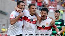STUTTGART, GERMANY - AUGUST 14: Marc-Oliver Kempf of VfB Stuttgart celebrates with teammates Hamadi Al Ghaddioui (L) and Wataru Endo after scoring their side's third goal during the Bundesliga match between VfB Stuttgart and SpVgg Greuther Fürth at Mercedes-Benz Arena on August 14, 2021 in Stuttgart, Germany. (Photo by Thomas Niedermueller/Getty Images)