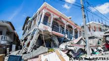 FILE PHOTO: A view shows houses destroyed following a 7.2 magnitude earthquake in Les Cayes, Haiti August 14, 2021. REUTERS/Ralph Tedy Erol NO RESALES. NO ARCHIVES/File Photo