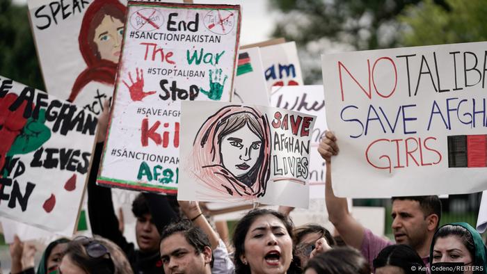 Demonstrators in Washington hold up placards calling for peace in Afghanistan.