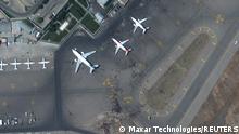 Crowds of people are seen on the tarmac at Kabul's airport in Afghanistan August 16, 2021. SATELLITE IMAGE 2021 MAXAR TECHNOLOGIES/Handout via REUTERS. ATTENTION EDITORS - MUST NOT OBSCURE WATERMARK. THIS IMAGE HAS BEEN SUPPLIED BY A THIRD PARTY. MANDATORY CREDIT. NO RESALES. NO ARCHIVES.