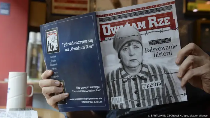 Angela Merkel as a concentration camp inmate behind barbed wire on the cover of the Polish magazine Uwazam Rze.