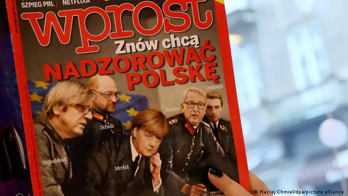 Angela Merkel on the cover of the Polish magazine Wprost as a leader surrounded by several men. 