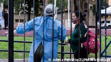 April 14, 2021, City of Buenos Aires, City of Buenos Aires, Argentina: INT. WorldNews. 2021, April 14. City of Buenos Aires, Argentina. A pregnant woman explains her symptoms of Covid-19 to a nurse at the Hospital Durand, city of Buenos Aires, Argentina and waits to be tested for Covid-19, on April 14, 2021..Today, Argentina confirms 25157 positive cases and 368 deaths. City of Buenos Aires Argentina - ZUMAf135 20210414_zap_f135_011 Copyright: xJulietaxFerrariox 