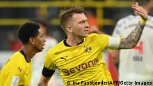 Dortmund's German forward Marco Reus celebrates scoring during the German Supercup football match BVB Borussia Dortmund vs FC Bayern Munich in Dortmund, on August 17, 2021. - DFL REGULATIONS PROHIBIT ANY USE OF PHOTOGRAPHS AS IMAGE SEQUENCES AND/OR QUASI-VIDEO (Photo by Ina Fassbender / AFP) / DFL REGULATIONS PROHIBIT ANY USE OF PHOTOGRAPHS AS IMAGE SEQUENCES AND/OR QUASI-VIDEO (Photo by INA FASSBENDER/AFP via Getty Images)