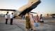People evacuated from Afghanistan in front of a German Bundeswehr airplane after arriving at the airport in Tashkent, Uzbekistan People evacuated from Afghanistan in front of a German Bundeswehr airplane after arriving at the airport in Tashkent, Uzbekistan