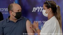 Israel's Prime Minister Naftali Bennett receives a booster shot for the coronavirus vaccine in the Meir Medical Center in Kfar Saba, Israel, Friday, Aug. 20, 2021. (AP Photo/Maya Alleruzzo)