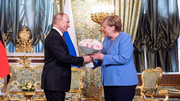 Russian President Vladimir Putin receives German Chancellor Angela Merkel at the Kremlin in Moscow