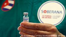 (210401) -- HAVANA, April 1, 2021 (Xinhua) -- A medical worker presents a dose of locally made COVID-19 vaccine Soberana 02 in Havana, Cuba on March 31, 2021. The Soberana 02 vaccine has entered phase 3 clinical trials earlier in March in Havana. (Photo by Joaquin Hernandez/Xinhua)