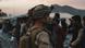 A US soldier assists evacuees during an evacuation at the Kabul airport A US soldier assists evacuees during an evacuation at the Kabul airport
