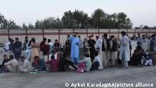 KABUL, AFGHANISTAN - AUGUST 18: Afghans wait as people waiting for evacuation at Hamid Karzai International Airport in Kabul, Afghanistan on August 18, 2021. Aykut Karadag / Anadolu Agency