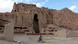 A person on a bike against the backdrop of the Bamiyan valley and gaping holes where a statue of Buddha once was A person on a bike against the backdrop of the Bamiyan valley and gaping holes where a statue of Buddha once was
