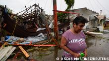 Martha Sanchez reacts while walking in front of her souvenir store that was destroyed when Hurricane Grace slammed into the coast with torrential rains, in Costa Esmeralda, near Tecolutla, Mexico August 21, 2021. REUTERS/Oscar Martinez