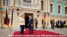 Ukrainian President Volodymyr Zelenskyy, right, greets German Chancellor Angela Merkel during their meeting in Kyiv, Ukraine, Sunday, Aug. 22, 2021. (Ukrainian Presidential Press Office via AP)