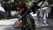 A Taliban fighter stands guard near a checkpoint in Kabul A Taliban fighter stands guard near a checkpoint in Kabul
