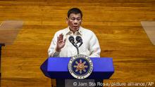 Philippine President Rodrigo Duterte gestures as he delivers his final State of the Nation Address at the House of Representatives in Quezon City, Philippines