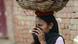 A manual scavenger in Uttar Pradesh covers her nose while carrying human waste after cleaning toilets in Nekpur village A manual scavenger in Uttar Pradesh covers her nose while carrying human waste after cleaning toilets in Nekpur village